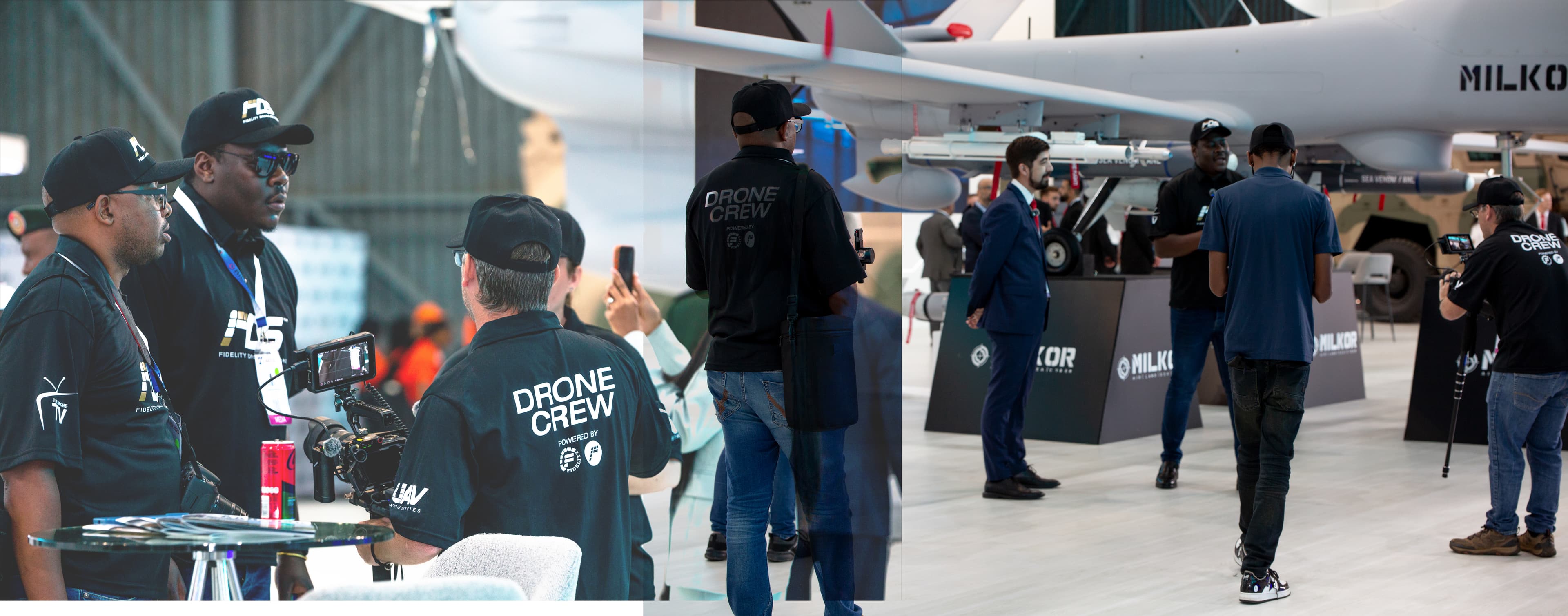 Drone crew members filming and observing a large military drone at an aviation trade show.